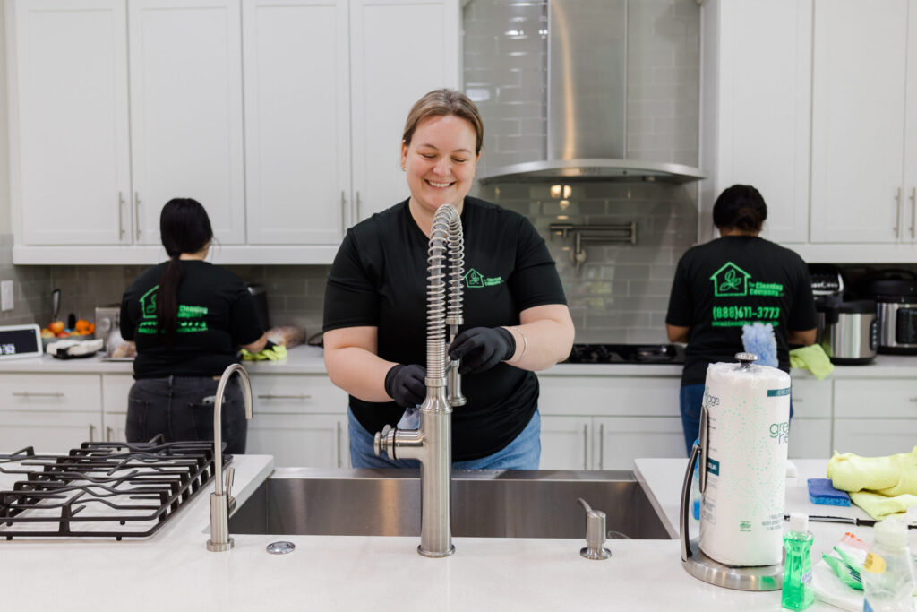 A professional residential cleaner preparing a bright, comfortable home